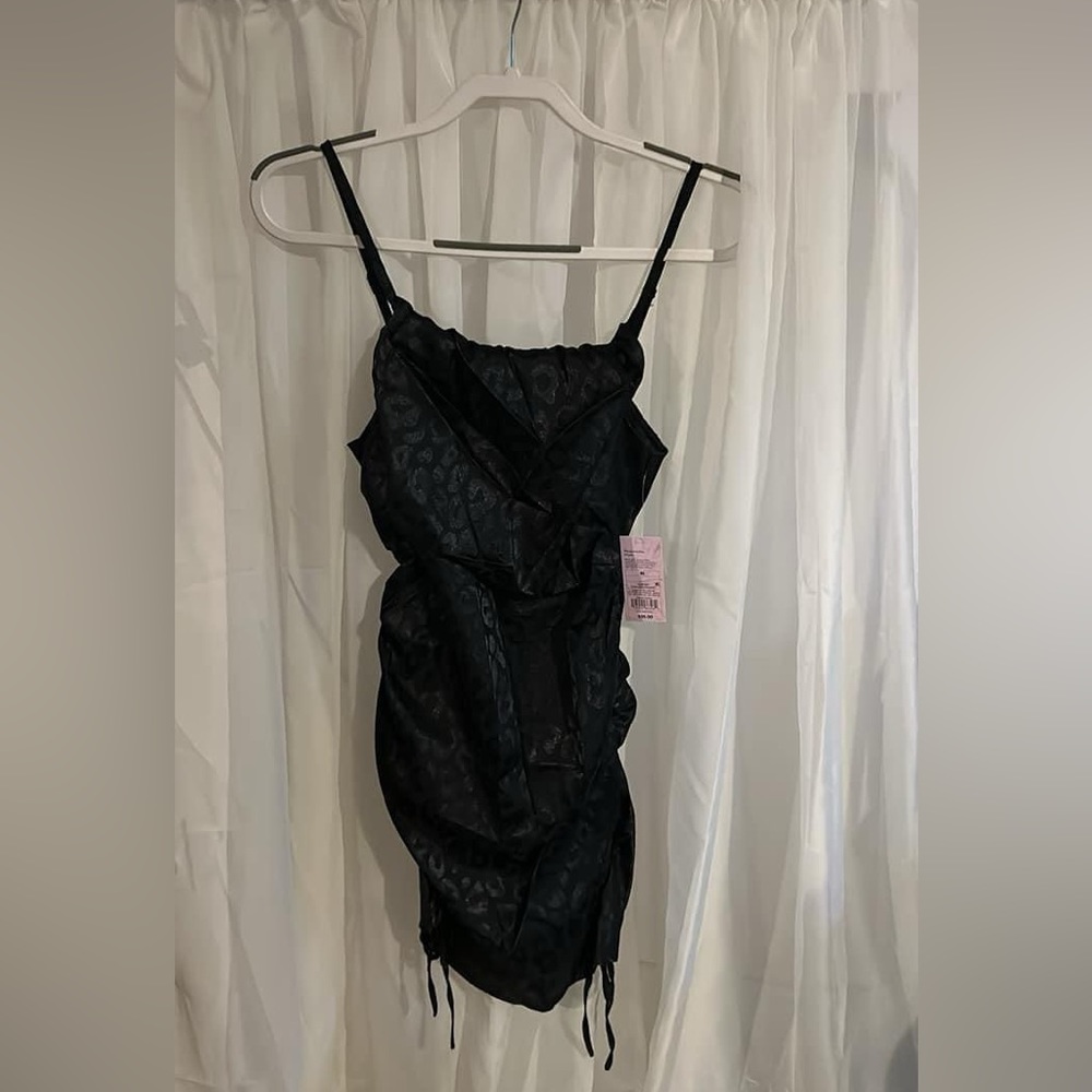 Brand new still with tags. Black dress. With leopard print.